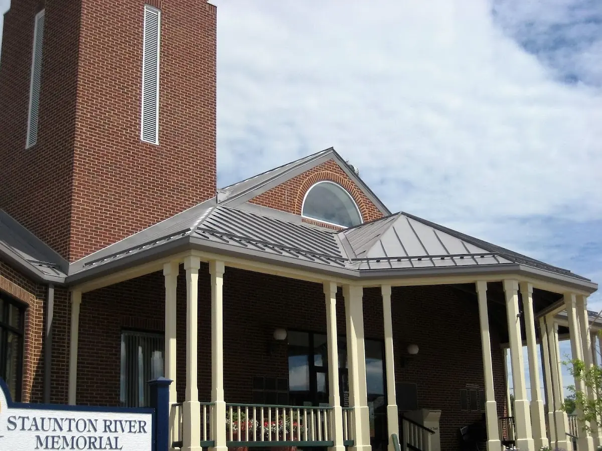 Skilled roofing craftsmen working on a residential roof in Seneca Falls